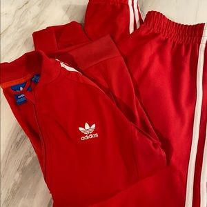 Adidas red track suit.
